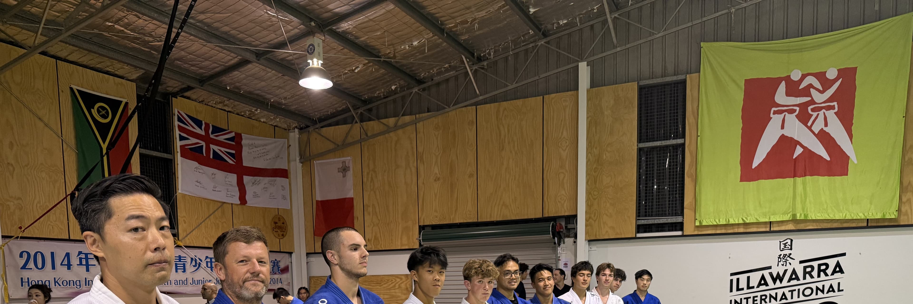 Participants lined up before a Kick Ass Kyu Grades event at IIJC
